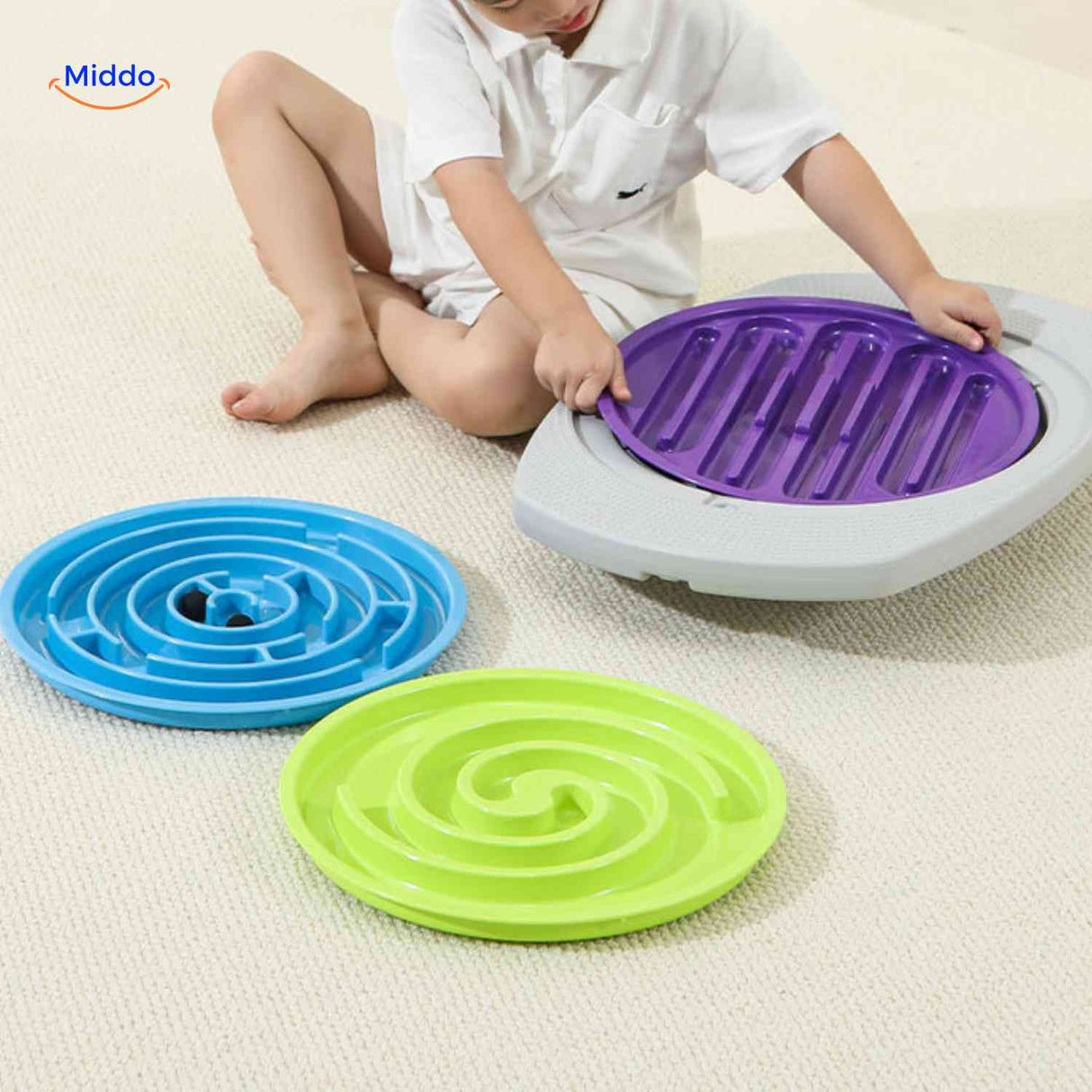Interchangeable maze discs in purple, green, and blue color options