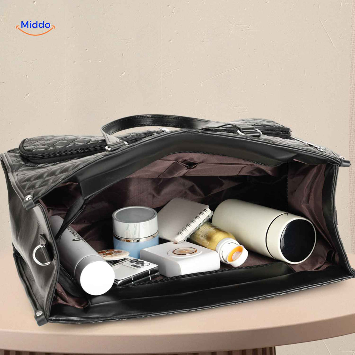 Black Totezia handbag showing spacious interior with multiple storage compartments.