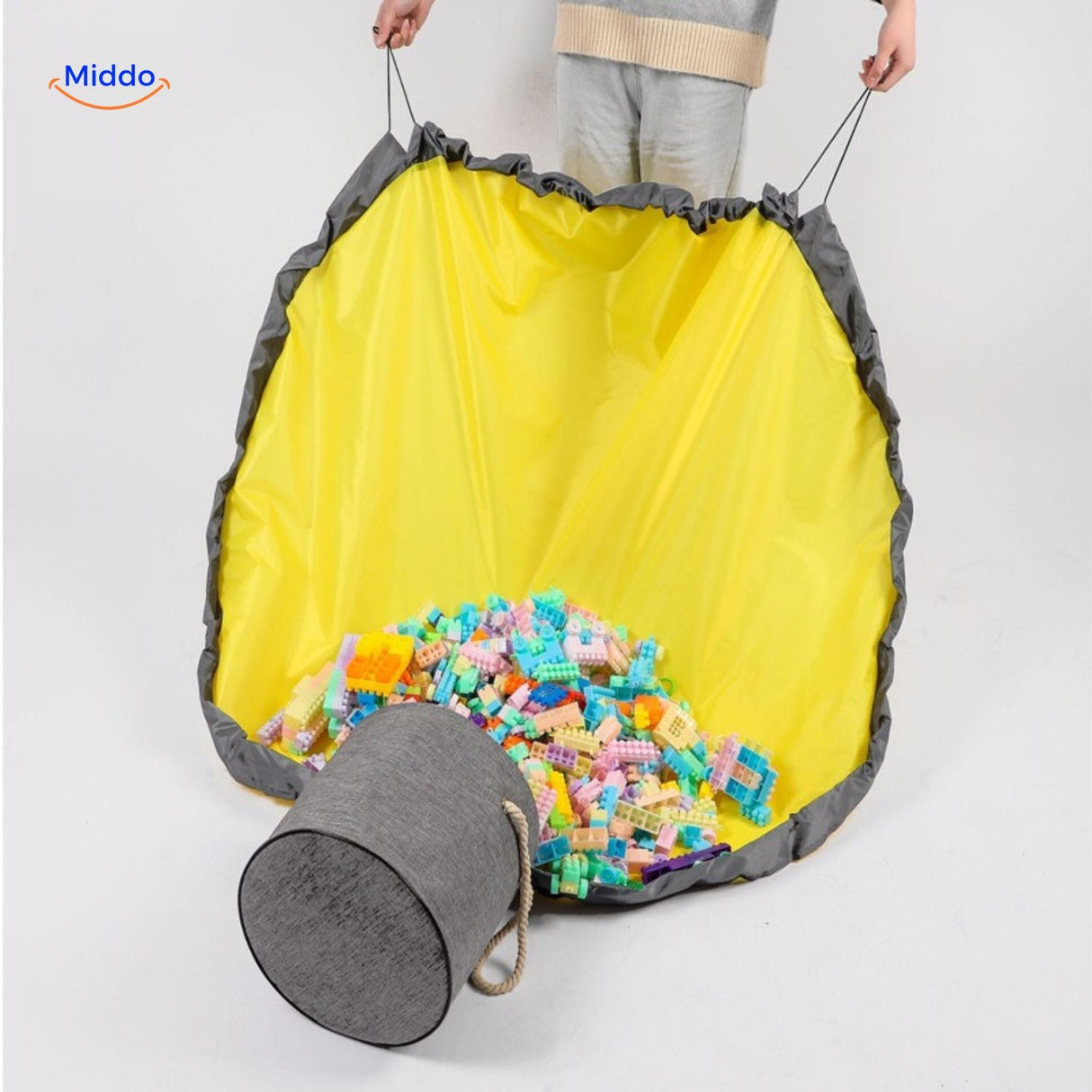 Toy storage bag partially filled with colorful building blocks.