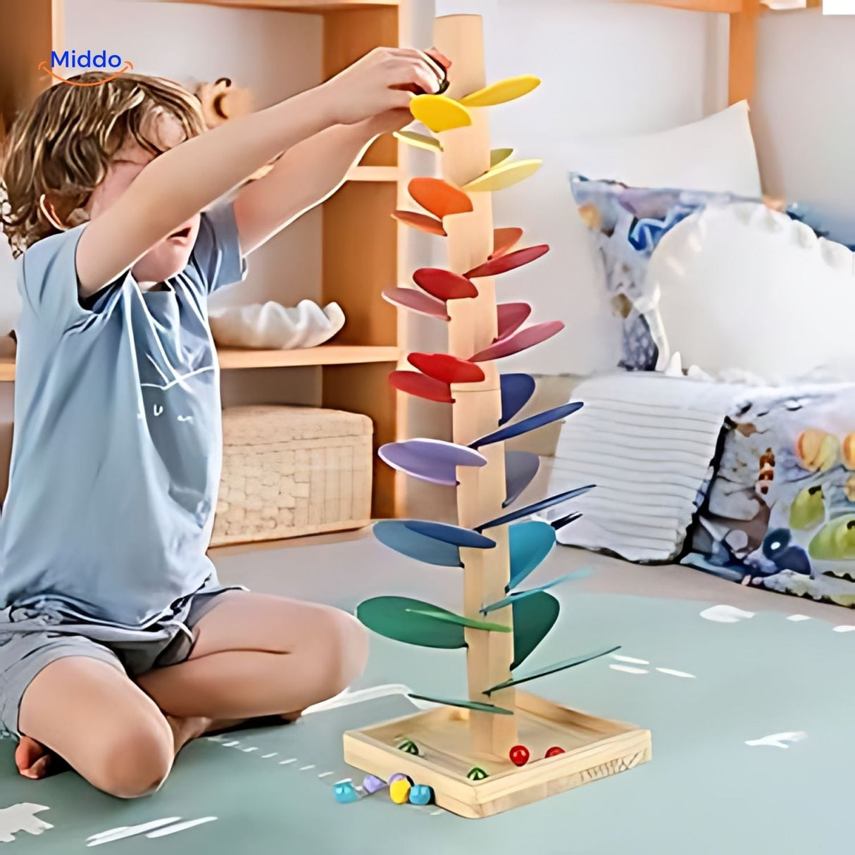 Boy enjoying wooden ball run tree toy on living room floor.