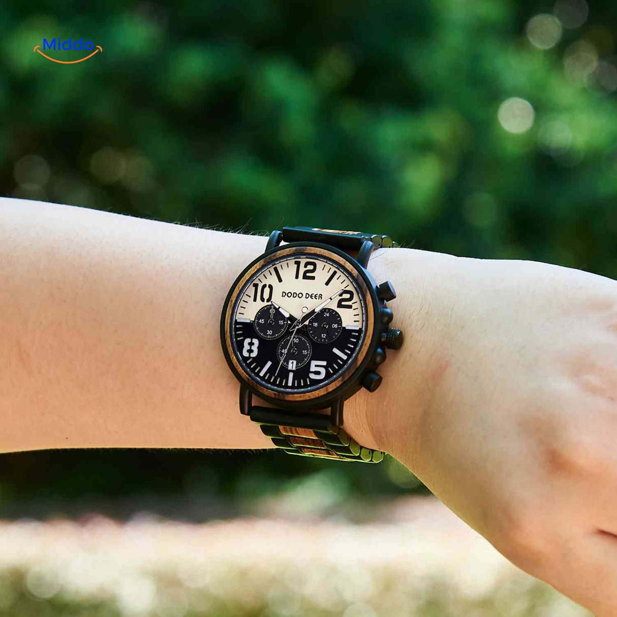 Wooden chronograph watch in natural light worn outdoors showcasing classic design.