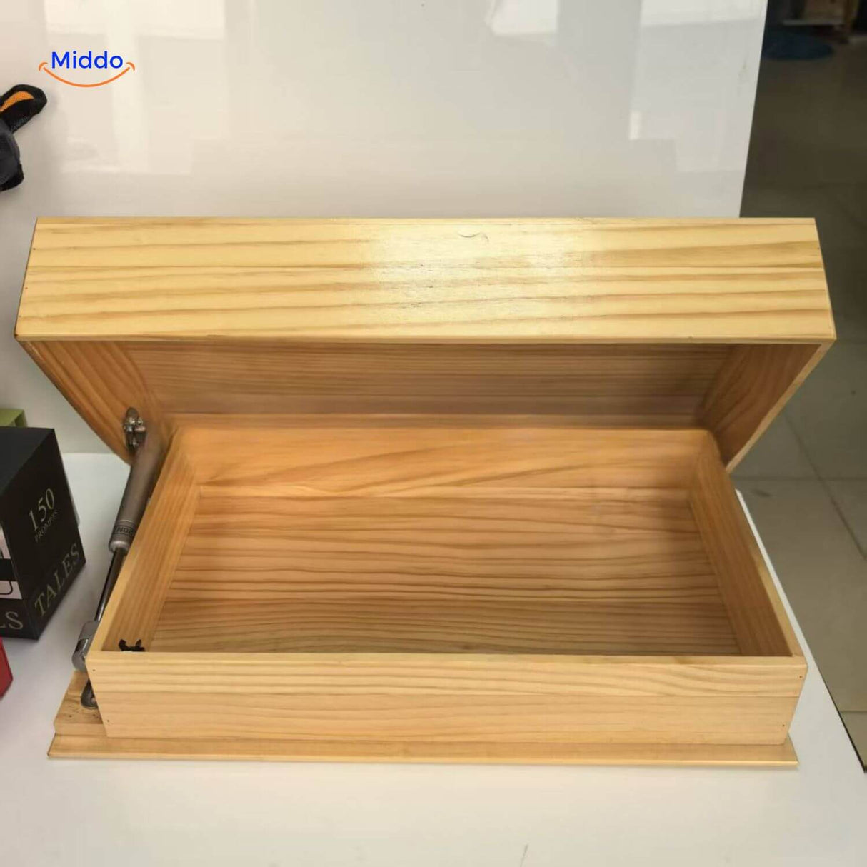 Floating shelf with wooden storage box featuring a removable lid compartment.