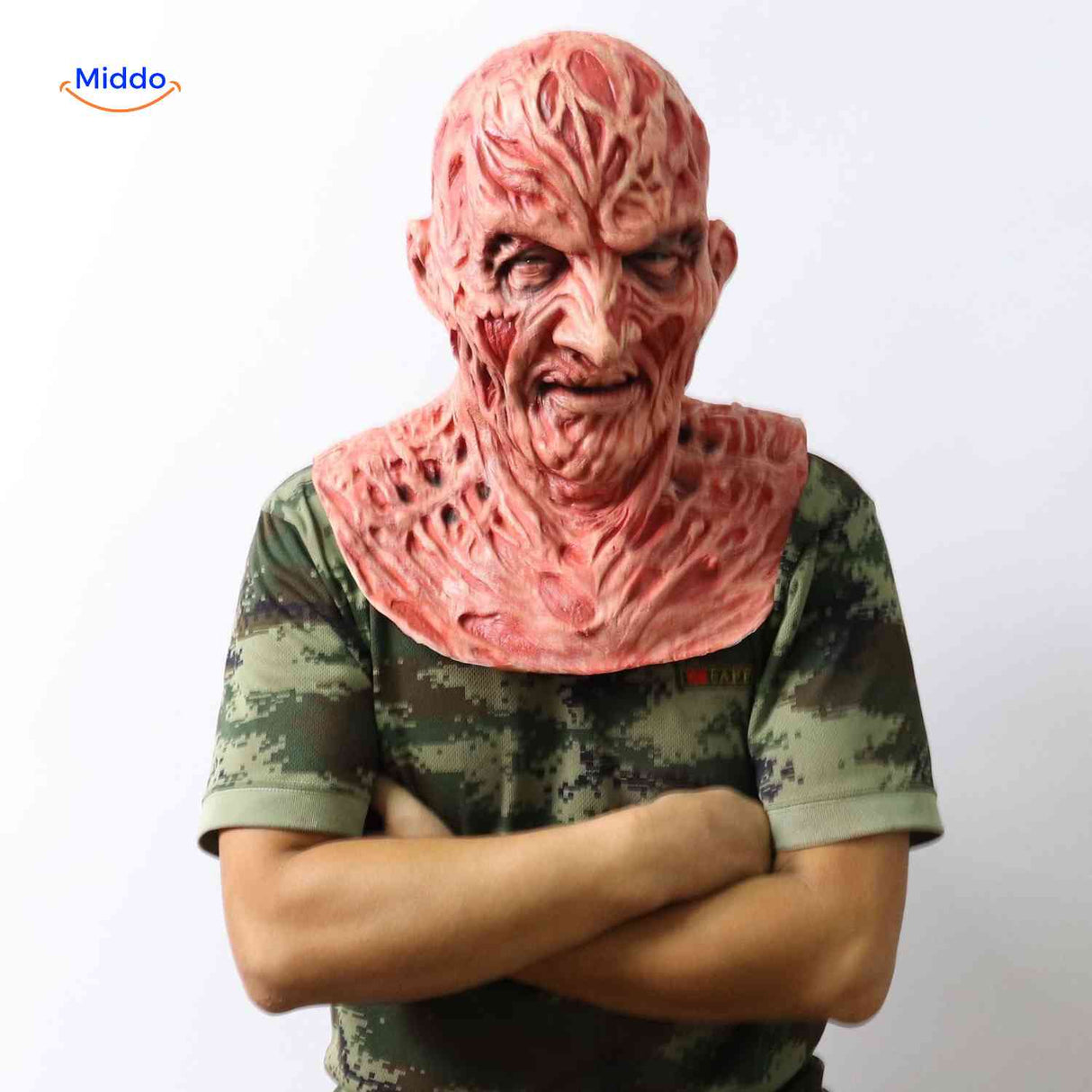 Side view of person in camo shirt wearing realistic Zombiora mask.