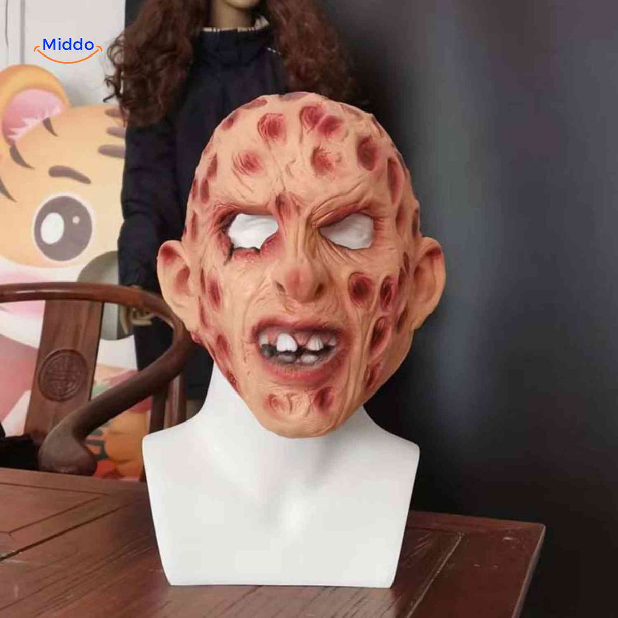 Zombiora mask featuring red spots and menacing visible teeth detail.