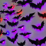 3D LED bat light with decorative Halloween wall installation.