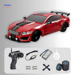4WD drift RC car in red displayed with all included accessories laid out