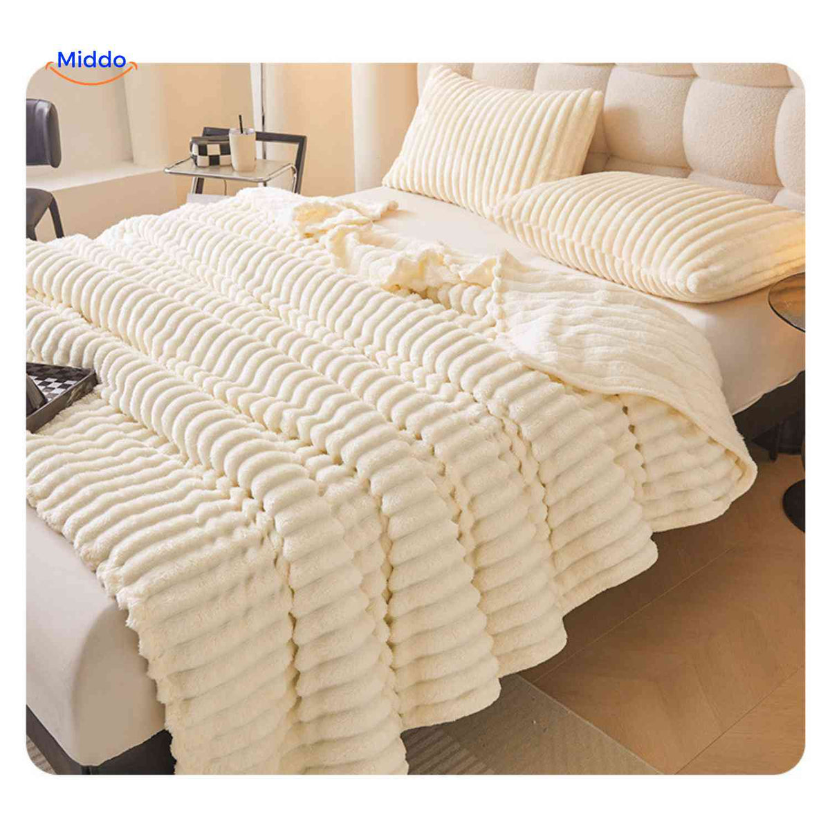 Fluffina luxury plush blanket styled on a bed