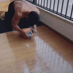 Ab wheel trainer in use showing smooth rolling motion during core exercise.