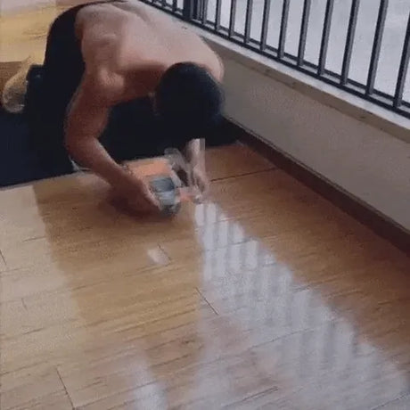 Ab wheel trainer in use showing smooth rolling motion during core exercise.