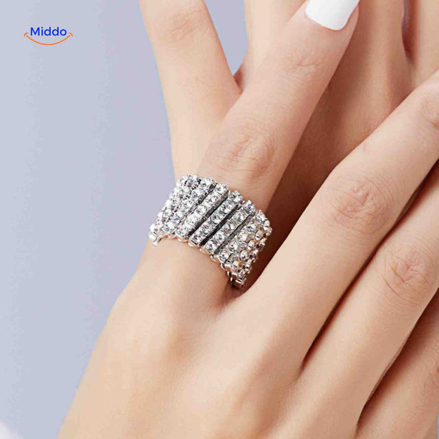 Adjustable ring bracelet in gold with white crystal rhinestones, wide design.
