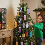 Child opening and discovering mini energy drink cans from the advent calendar.