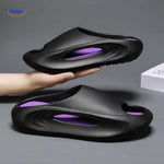 Aerostep thick-sole sport sandals in black with purple accent stripe styling.