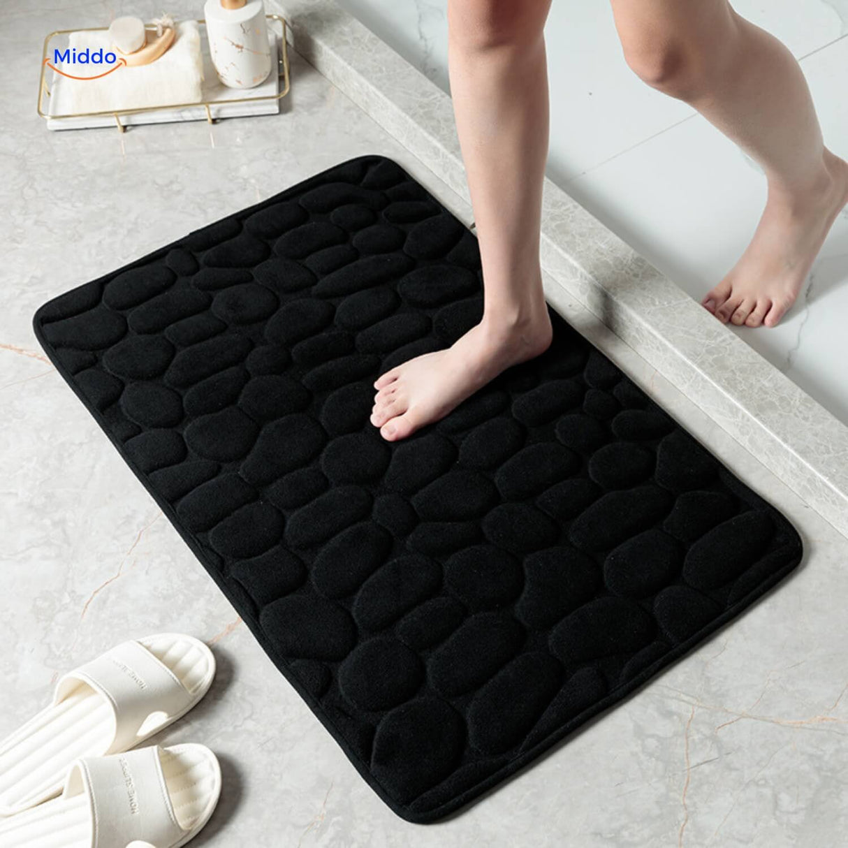 Anti-slip bath mat in black providing safety and water absorption for any bathroom.