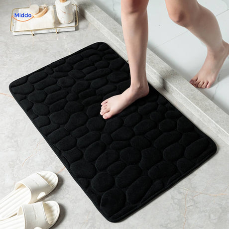 Anti-slip bath mat in black providing safety and water absorption for any bathroom.