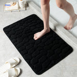 Anti-slip bath mat in black providing safety and water absorption for any bathroom.