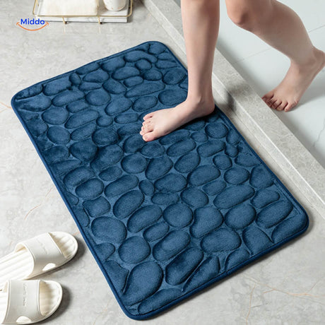 Anti-slip bath mat in dark blue color with waterproof backing.