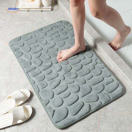 Anti-slip bath mat in gray color with non-slip backing for bathroom safety.