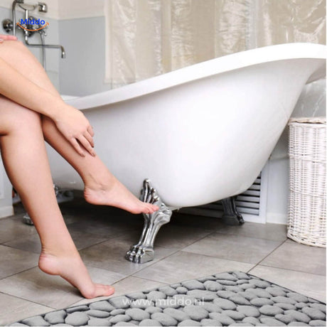 Anti-slip bath mat in bathroom setting showing water-absorbing surface and safety benefits.