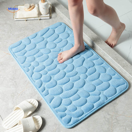 Anti-slip bath mat in light blue color with non-slip grip technology.