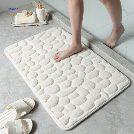 Anti-slip bath mat in white color providing safety and water absorption.