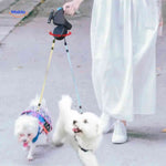 Anti-tangle dual dog leash keeping two dogs walking smoothly together.