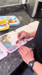 AquaDraw water coloring book in use with a reusable water pen