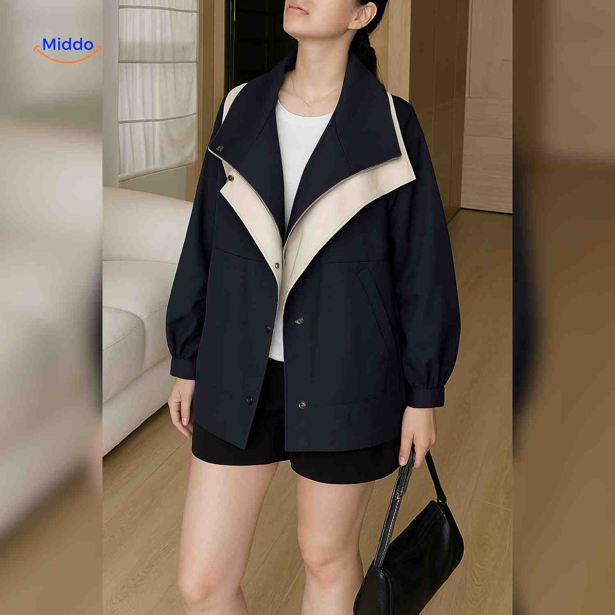 Casual AquaShell trench coat in black with contrasting collar detail.