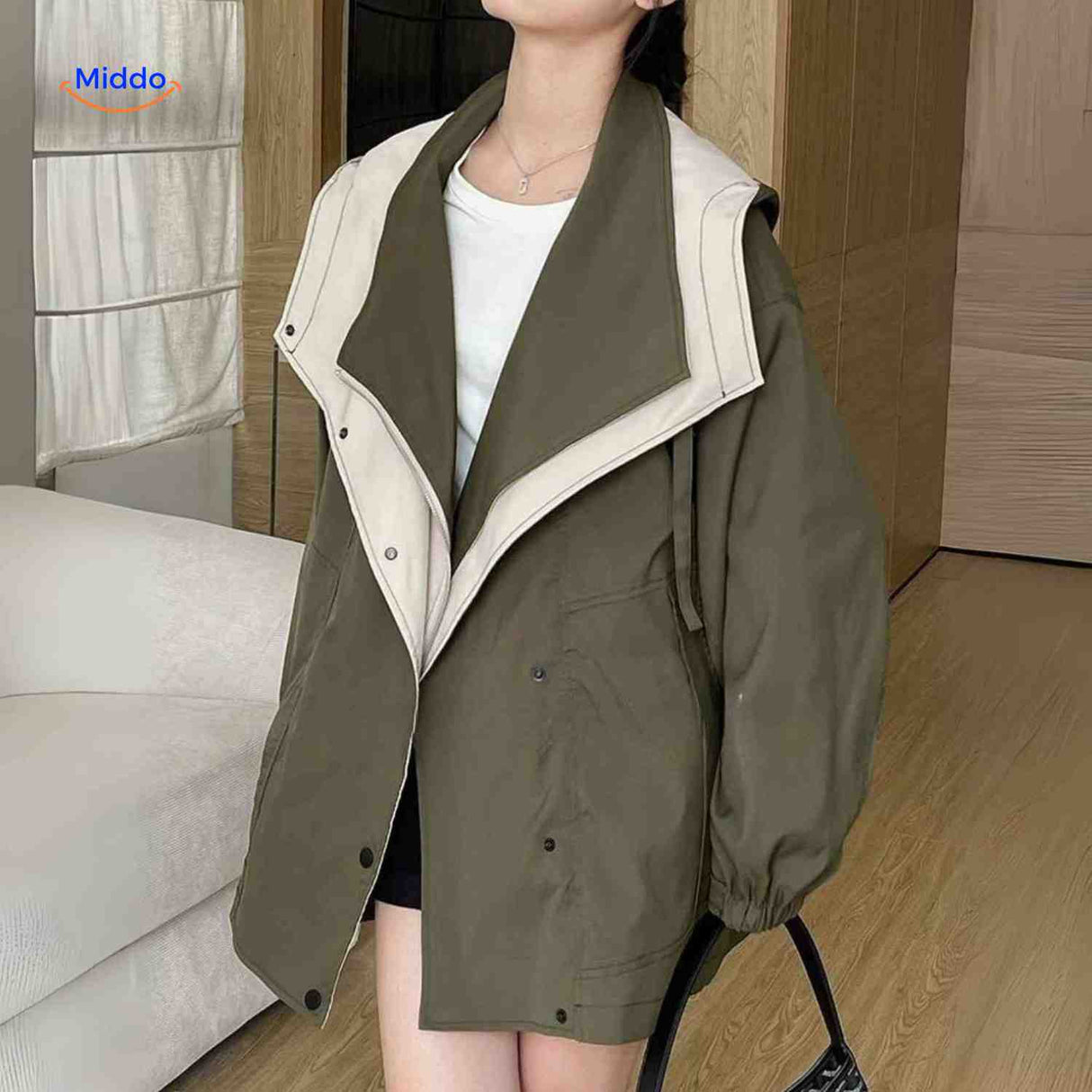 Comfortable AquaShell trench coat in green with contrast collar.