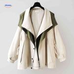 AquaShell women's trench coat in cream with green collar detail, oversized fit.