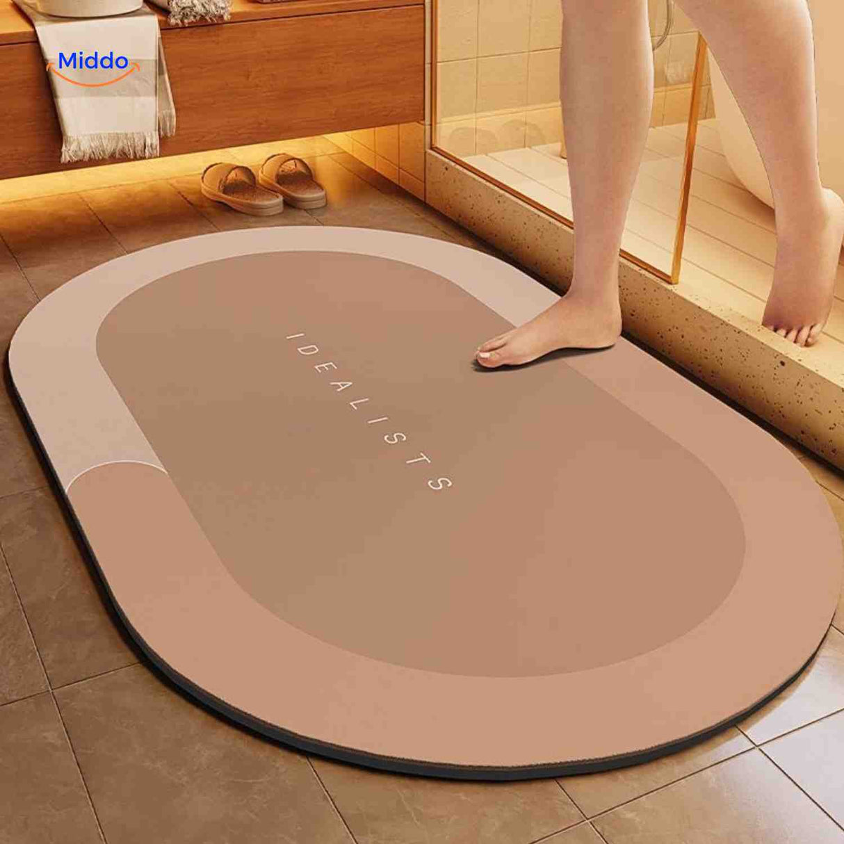 Brown oval non-slip water-absorbing bath mat with soft pile surface.