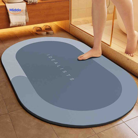 Light blue-gray oval water-absorbing bath mat for modern bathrooms.