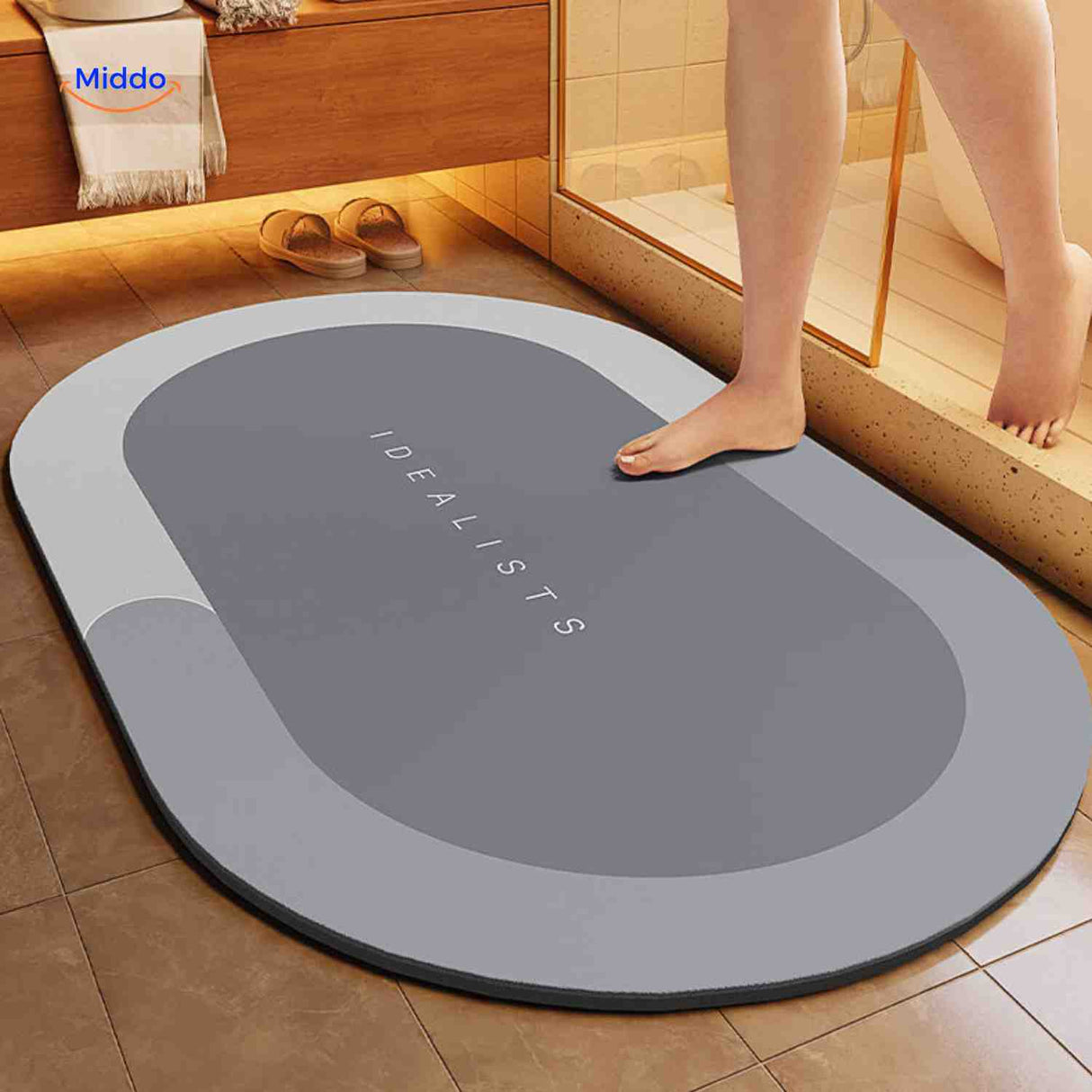 Light gray oval water-absorbing bath mat with reliable non-slip grip.