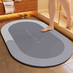 Light gray oval water-absorbing bath mat with reliable non-slip grip.