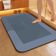 Rectangle blue-gray quick-dry non-slip bath mat with water-absorbing fibers.