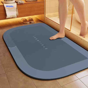 Underside view of dark gray non-slip bath mat showing grip backing.