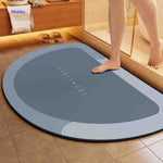 Semi-circle quick-dry bath mat adds soft non-slip surface to bathroom.