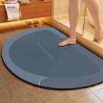 Semi-circle blue-gray quick-dry bath mat perfect for corner placement.