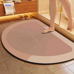 Brown semi-circle quick-dry bathroom mat with reliable grip backing.
