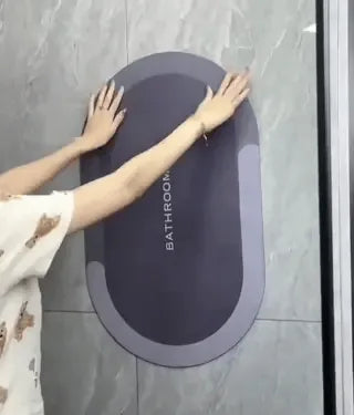 Quick-dry bath mat rolled up demonstrating flexible storage capability.