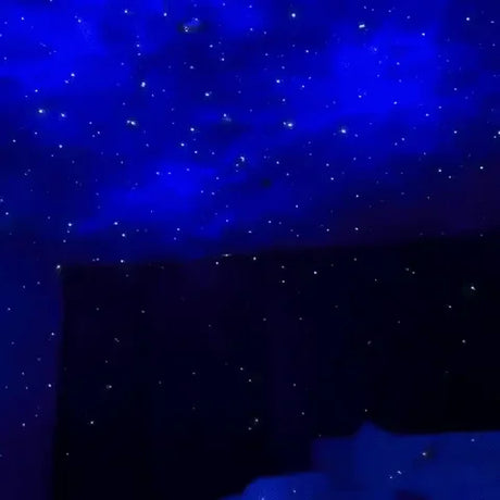 Astronaut galaxy projector creating starfield ceiling projection with constellation patterns.