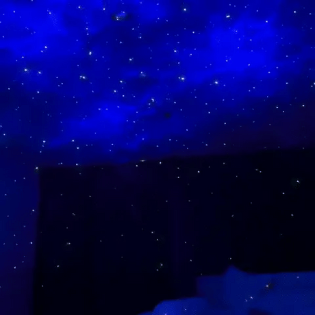 Astronaut galaxy projector creating starfield ceiling projection with constellation patterns.