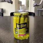 Automatic jar opener handles pickle jars and sealed containers easily.