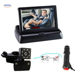 Automatic baby car camera with display unit monitoring infant in car seat.