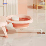 Innovative baby bath chair with water drainage system and integrated basin for easy cleanup.