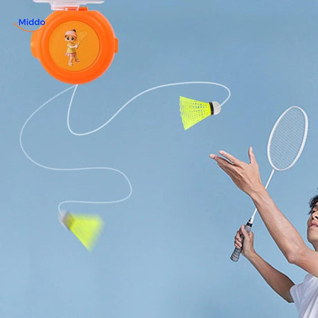 Man playing with Spinpro badminton trainer indoors for solo practice