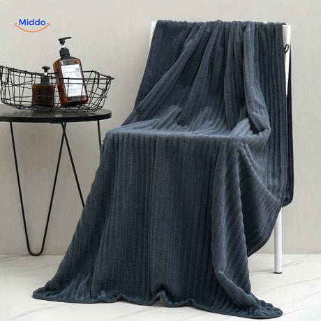 Dark blue bath towel with superior absorbent and quick-dry features.