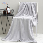 Dark blue bath towel made from quality material with absorbent properties.