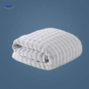 Gray waffle-textured bath towel combining style and functionality.