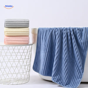 White bath towel with absorbent and quick-dry properties for gifting.