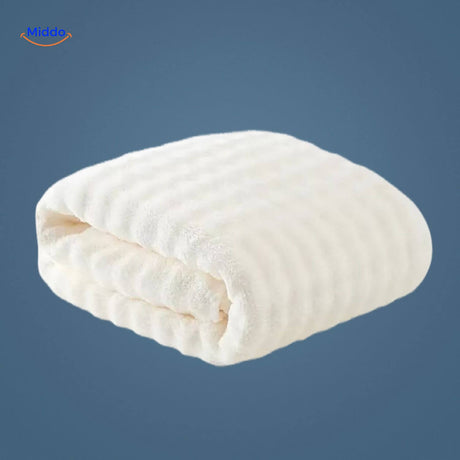 White waffle-textured bath towel with premium quick-dry fabric.